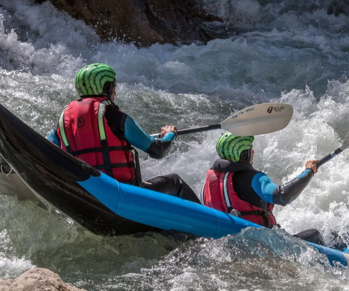 Riding inflatable canoe with guide in southeast France